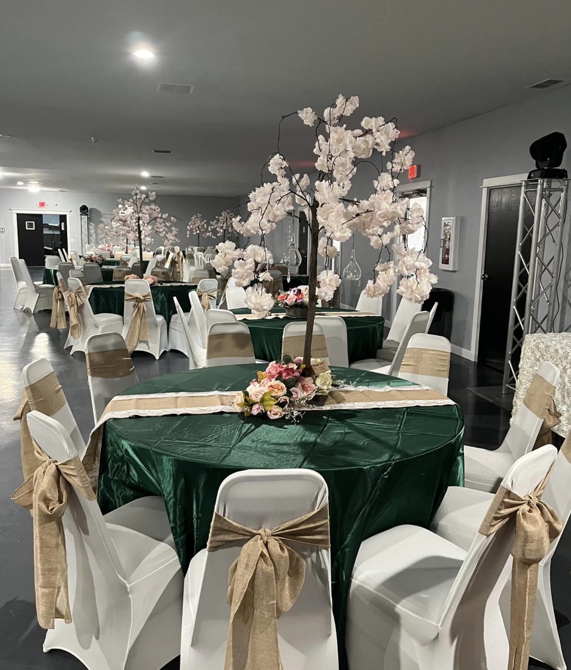 Rustic emerald and burlap décor with cherry blossom trees